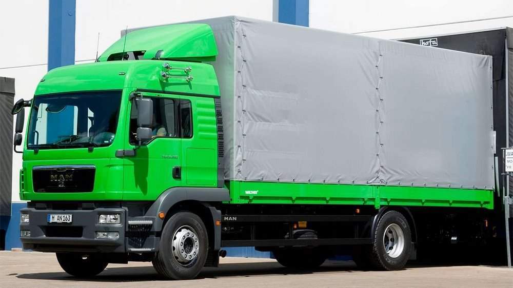 Зеленый грузовик МАН ТГМ 2 4х2